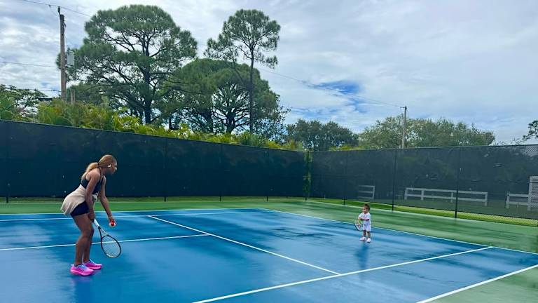 This is me sharing my passion for tennis with my youngest daughter.