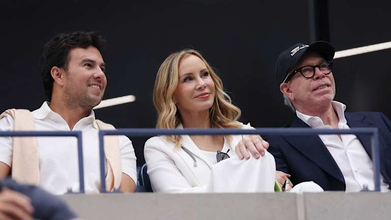 Formula 1 driver Sergio “Checo” Perez watches on alongside fashion designer Tommy Hilfiger (right) and wife Dee Hilfiger.