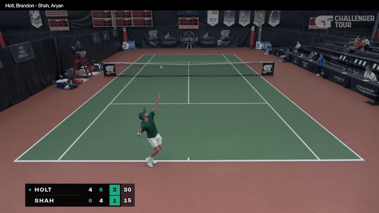 Holt serves to Aryan Shah, Tuesday night in Lincoln, Nebraska.